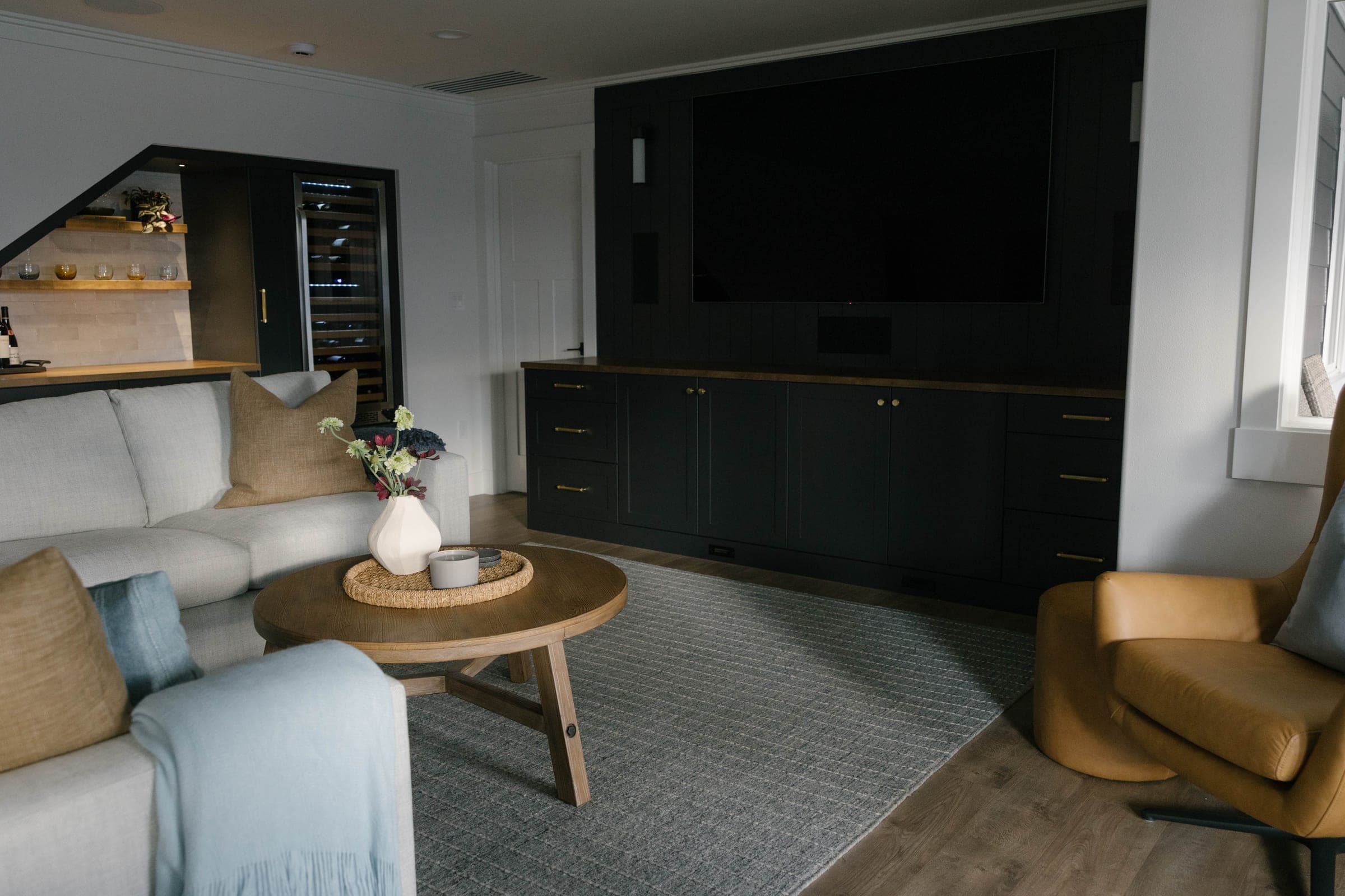 Highlands Basement media room with a dark shiplap media wall and custom built-ins, Issaquah