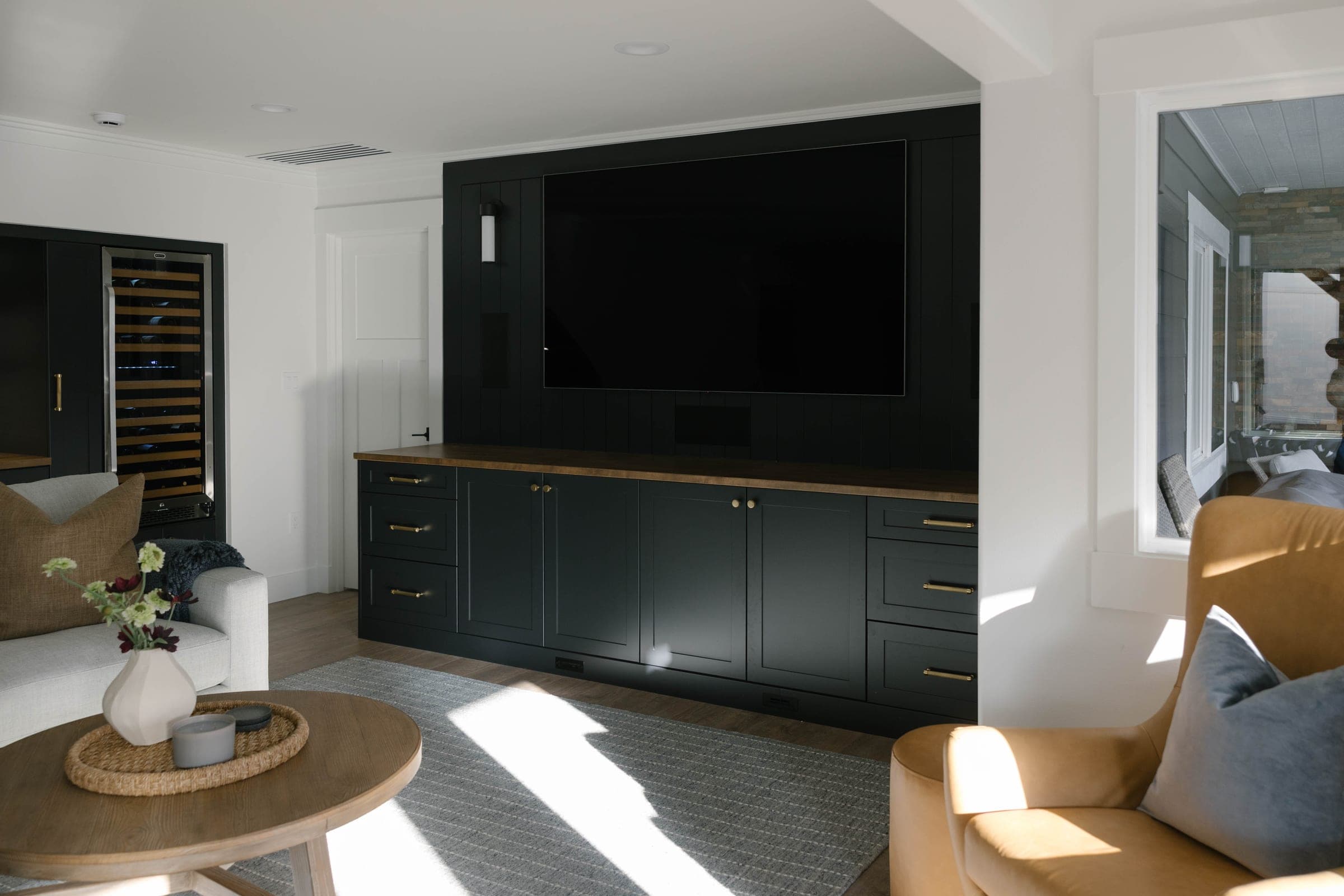 Custom black media built-in wall in the Highlands Basement, Issaquah