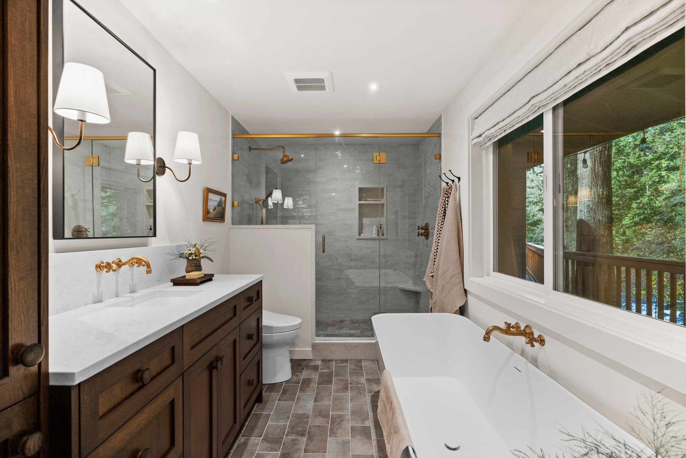 River Front Master Suite ensuite with a freestanding soaking tub, tiled shower and river-facing windows